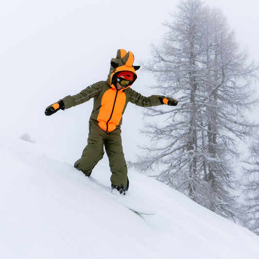Child snowboarding in the KHAMONDO Snowsuit