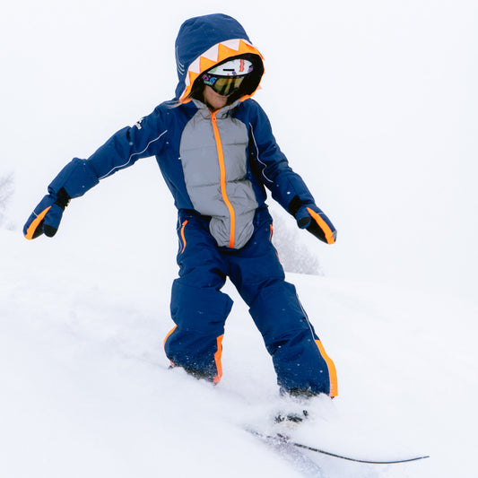 Child snowboarding in the SHARKDO Snowsuit