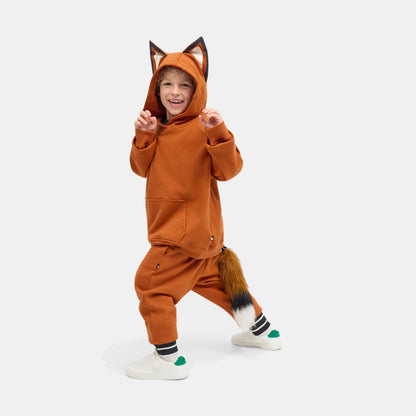 Child playing in the FOXDO Sweatsuit with the hood up and the fox ears standing on the hood.