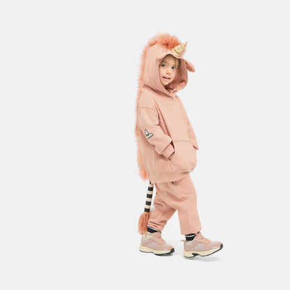Child walking in the UNIDO Sweatsuit with the hood up, showing the relaxed fit of the set.