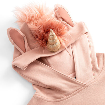 Close-up of the UNIDO hood — glitter unicorn horn, blush faux-fur mane and pink-lined ears.