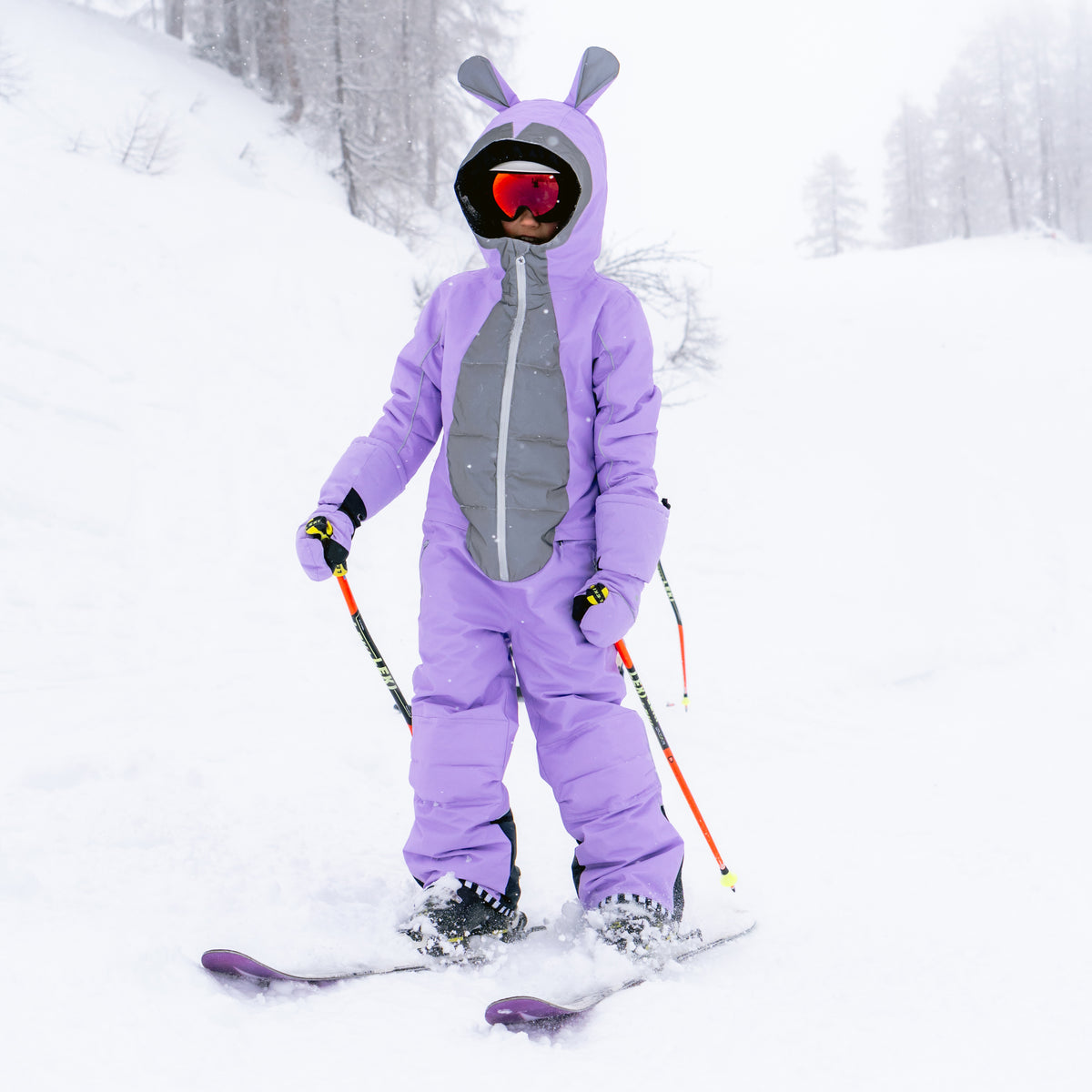 Child skiing in the BUNNYDO Purple Snowsuit