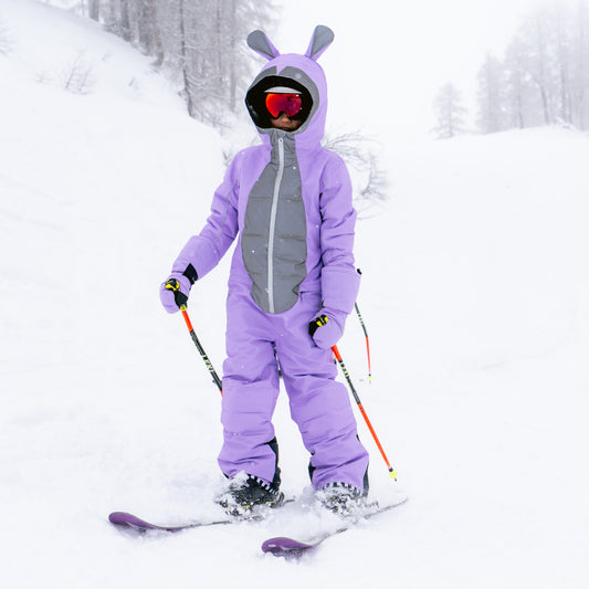 Child skiing in the BUNNYDO Purple Snowsuit
